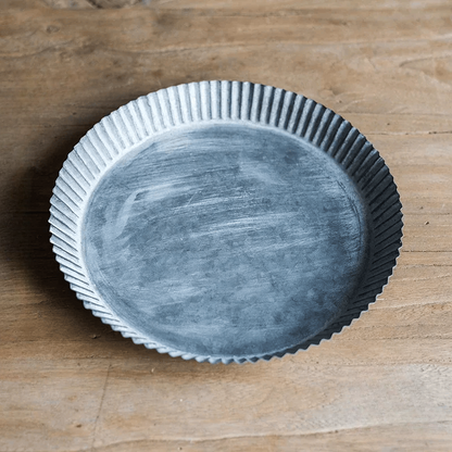 Rustic Fluted Metal Tray by RusticReach, round metal with fluted edge on wood surface on Tampa Home & Garden Store