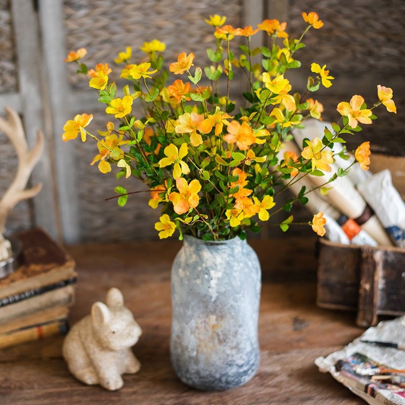 Faux Silk Gaura Flower Stem 20in with yellow-orange blooms in a rustic blue vase on Tampa Home & Garden Store