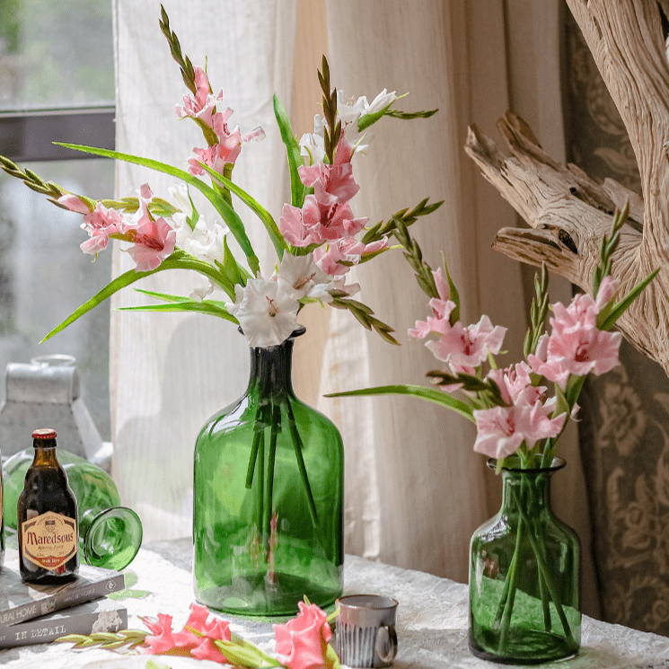 Faux Silk Gladiolus Flower Stems in a pair of green glass vases with pink and white blooms on Tampa Home & Garden Store