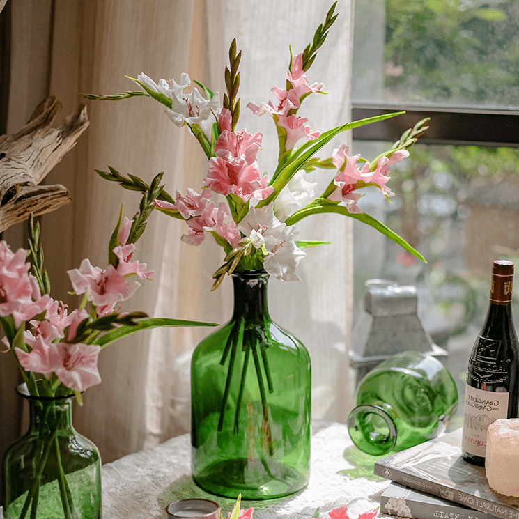 Faux Silk Gladiolus Flower Stem by RusticReach with pink blooms in green glass bottle vases on Tampa Home & Garden Store