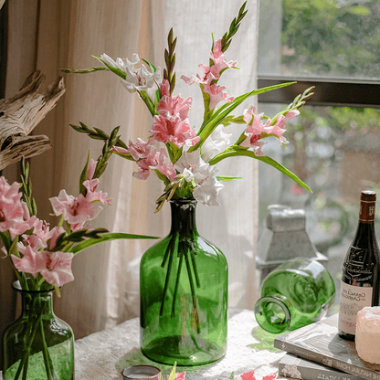 Faux Silk Gladiolus Flower Stem by RusticReach with pink blooms in green glass bottle vases on Tampa Home & Garden Store