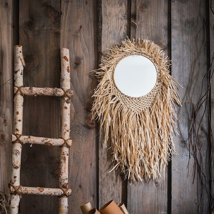 Handcraft Grass Hanging Round Mirror with natural raffia fringe on a rustic wooden wall on Tampa Home & Garden Store