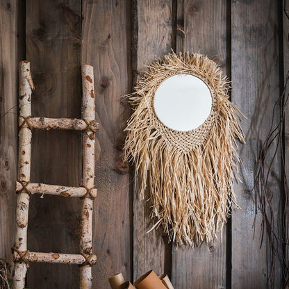 Handcraft Grass Hanging Round Mirror with natural raffia fringe on a rustic wooden wall on Tampa Home & Garden Store