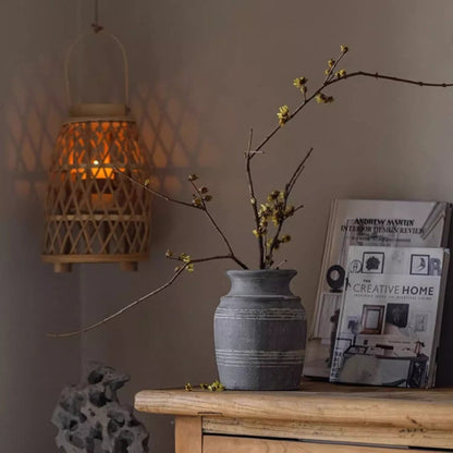 Handmade gray clay pottery vase by RusticReach with subtle horizontal bands on a wooden surface on Tampa Home & Garden Store