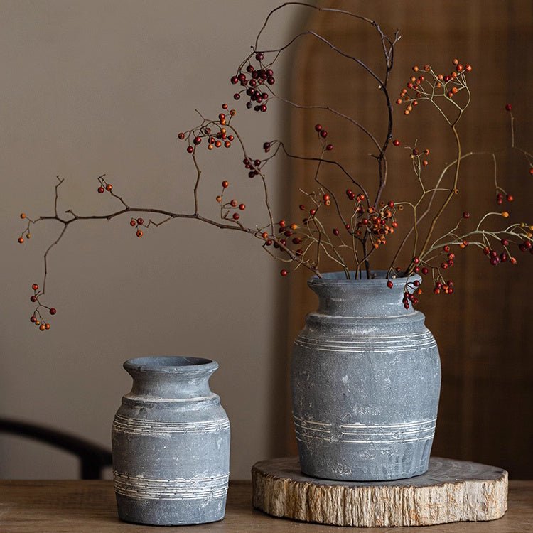 Handmade gray clay pottery vases by RusticReach, two vases on a wood pedestal on Tampa Home & Garden Store