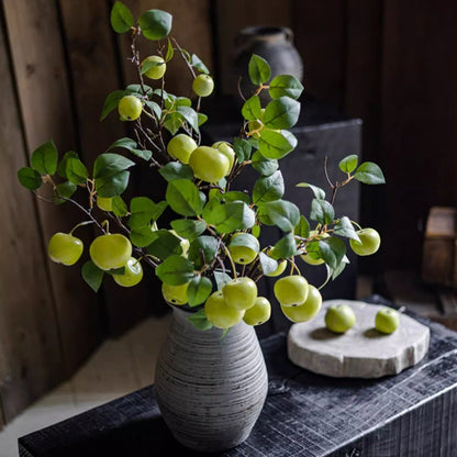 Artificial green apple branch with leaves in a textured grey ceramic vase on Tampa Home & Garden Store