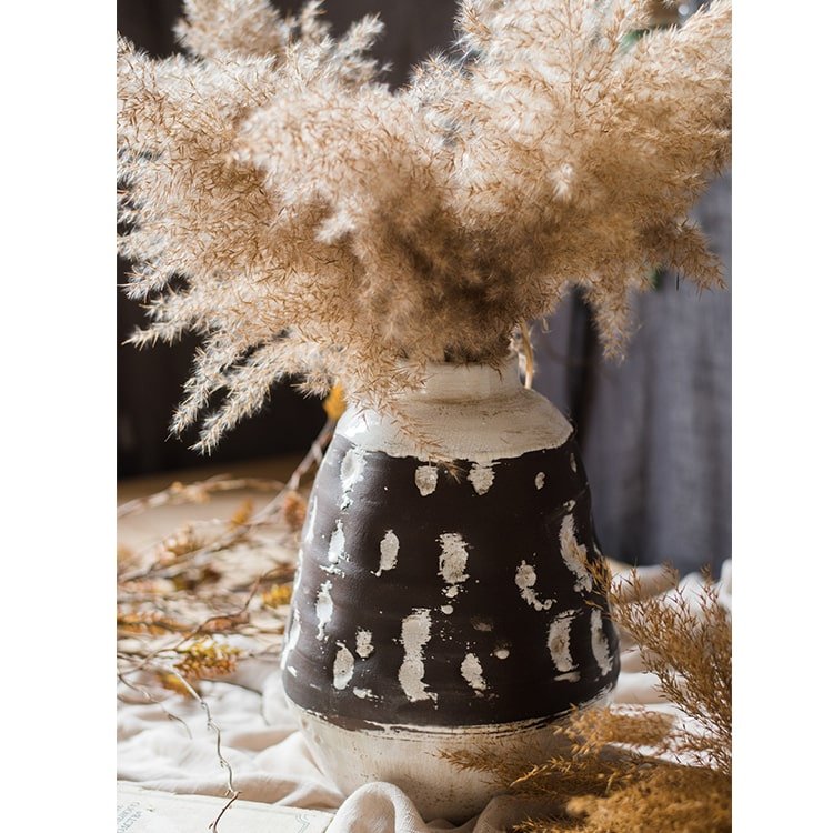 Handcrafted ceramic vase with black glaze, white speckles, beige neck, pampas grass on Tampa Home & Garden Store