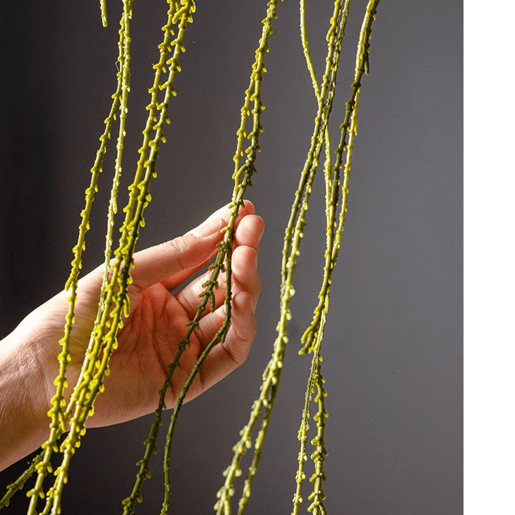 Artificial vine hanging thin succulent stem, RusticReach; yellow-green strands held by hand on Tampa Home & Garden Store