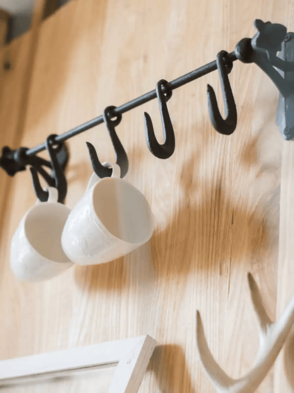 Farmhouse Iron Hook Rail by RusticReach; black iron rail with five hooks and two white mugs on Tampa Home & Garden Store