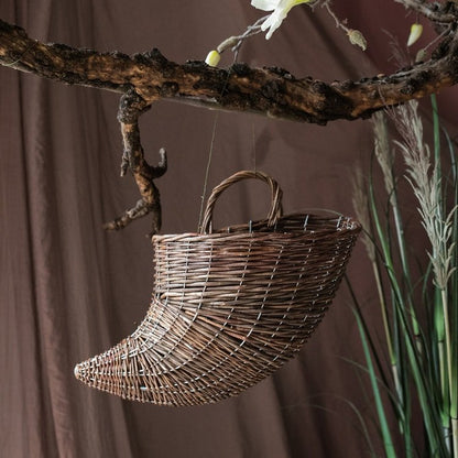 Horn shape willow hanging basket planter by RusticReach brown woven basket suspended from branch on Tampa Home & Garden Store