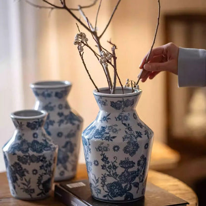 Indigo porcelain vase RusticReach with blue floral pattern; three vases on table, dried stems on Tampa Home & Garden Store