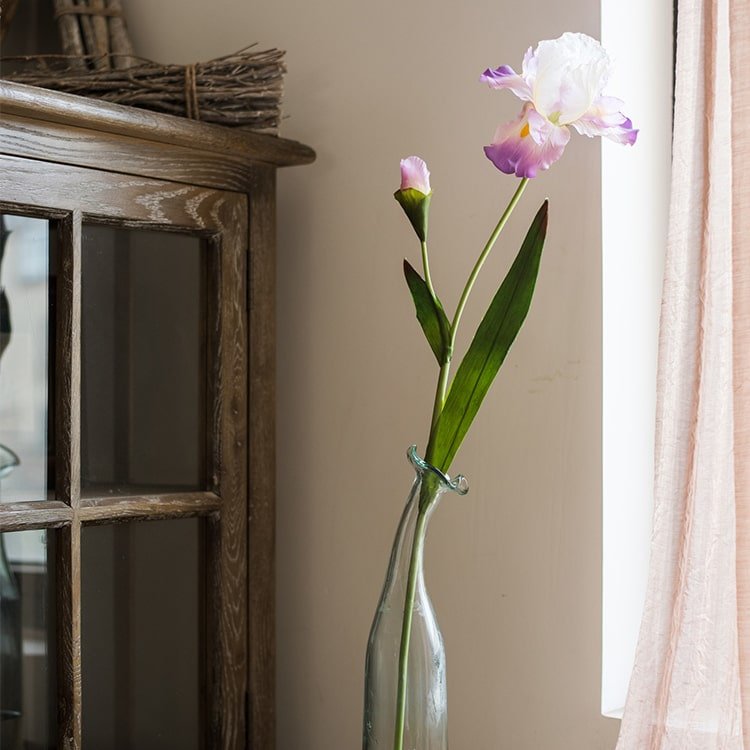 Silk iris artificial stem in clear glass bottle; white petals with purple edges on Tampa Home & Garden Store