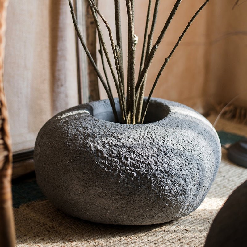 Japanese Zen Style Gray Stone Flowerpot by RusticReach, round textured planter with bare branches on Tampa Home & Garden Store