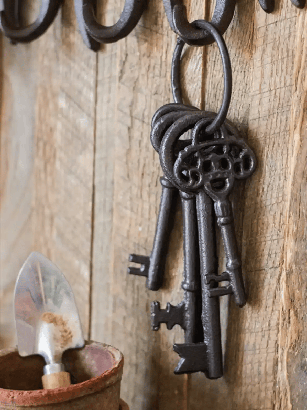 Farmhouse Vintage Key Wall Accent by RusticReach, dark iron ornate keys on rustic wood on Tampa Home & Garden Store