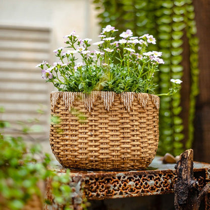 Lady Straw Basket Cement Planter by RusticReach with woven straw texture and white flowers on Tampa Home & Garden Store