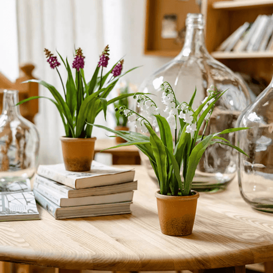Faux Lily of the Valley in brown pots by RusticReach; white blooms on a wooden table on Tampa Home & Garden Store