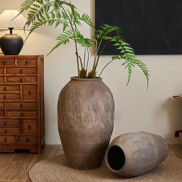Two large floor-standing clay pots by RusticReach; gray-brown ceramic with a textured finish on Tampa Home & Garden Store