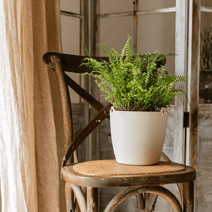 Modern resin hanging planter for artificial plants, white pot with fern on a rustic chair on Tampa Home & Garden Store