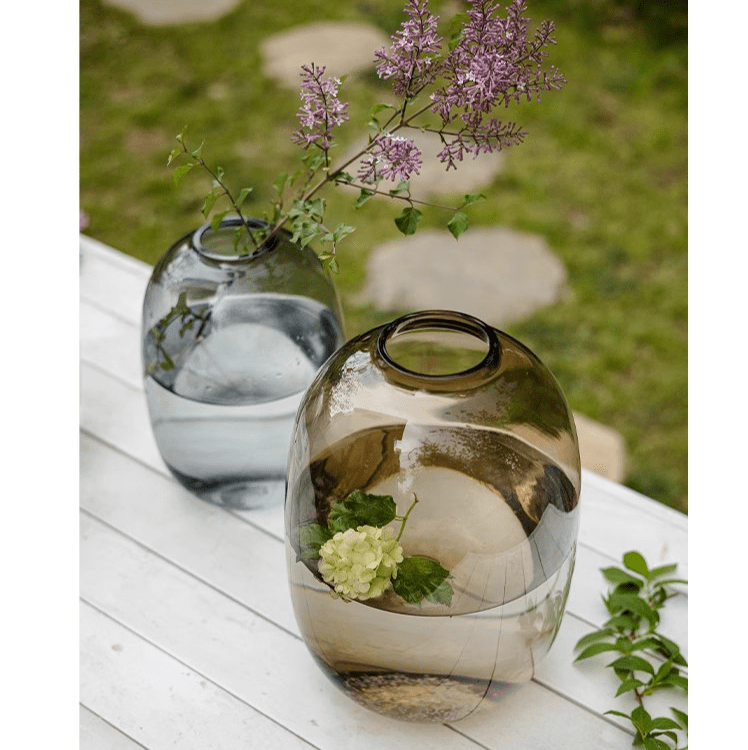 Modern clear glass vase pair RusticReach on a white wooden table with purple blooms on Tampa Home & Garden Store