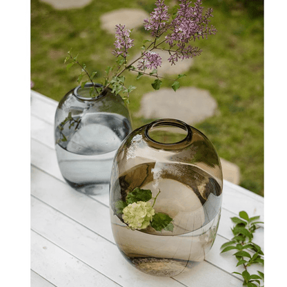 Modern clear glass vase pair RusticReach on a white wooden table with purple blooms on Tampa Home & Garden Store
