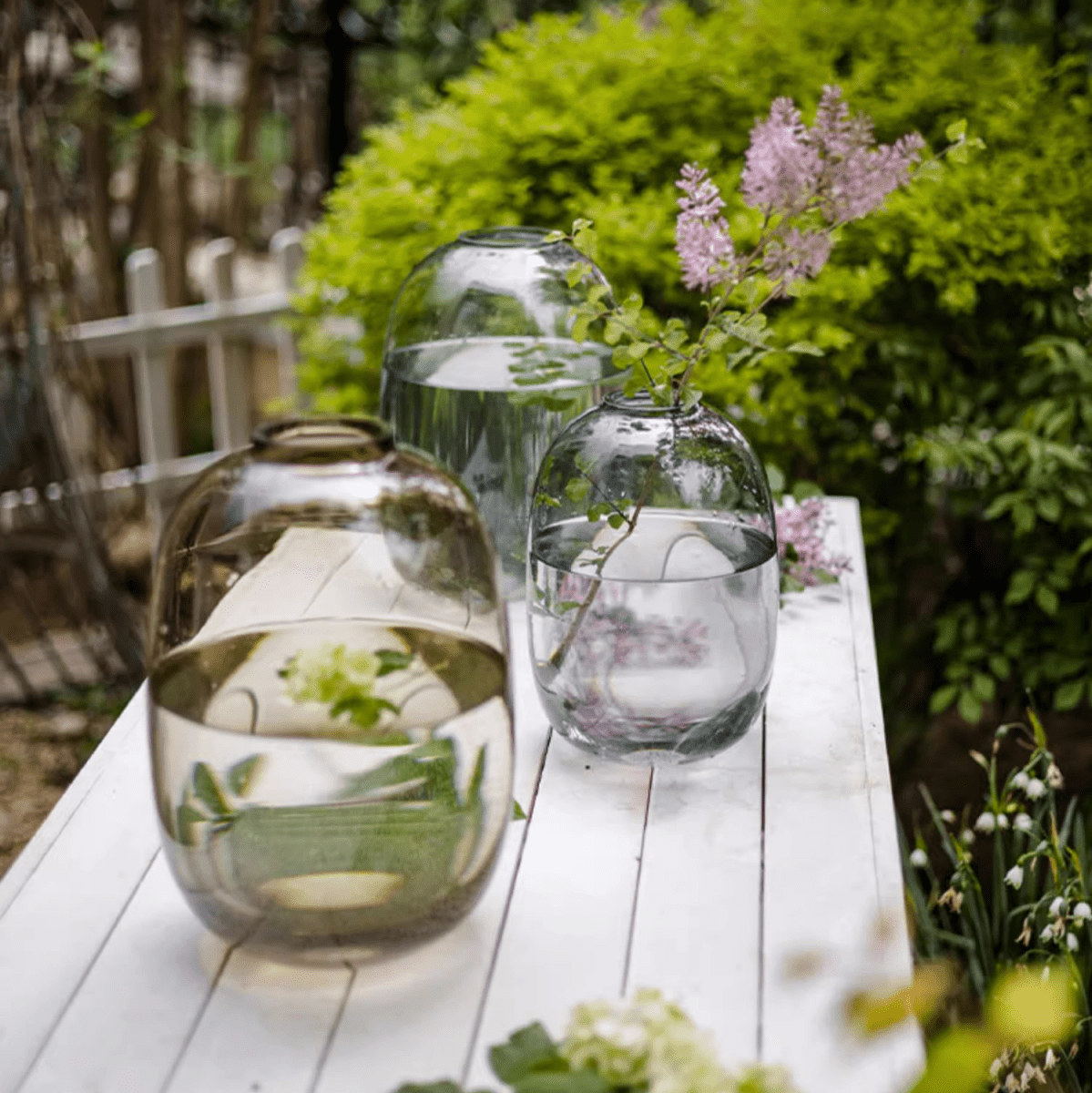 Modern Clear Glass Vase by RusticReach; three vases in amber and clear on a white outdoor table on Tampa Home & Garden Store
