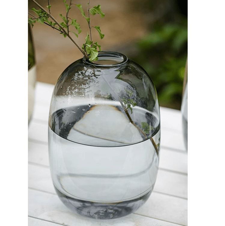 Modern Clear Glass Vase by RusticReach with rounded silhouette and greenery stem on Tampa Home & Garden Store