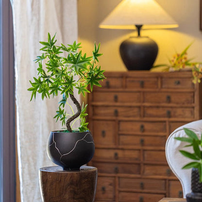 Mini faux potted green plant bonsai by RusticReach in a black veined pot on a wooden stand on Tampa Home & Garden Store