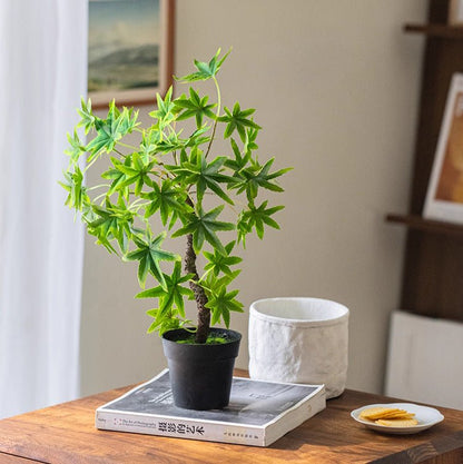 Mini faux green plant by RusticReach in a black pot on a wood desk on Tampa Home & Garden Store