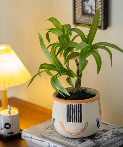Mini Faux Potted Green Plant by RusticReach in a decorative ceramic pot with motif on Tampa Home & Garden Store