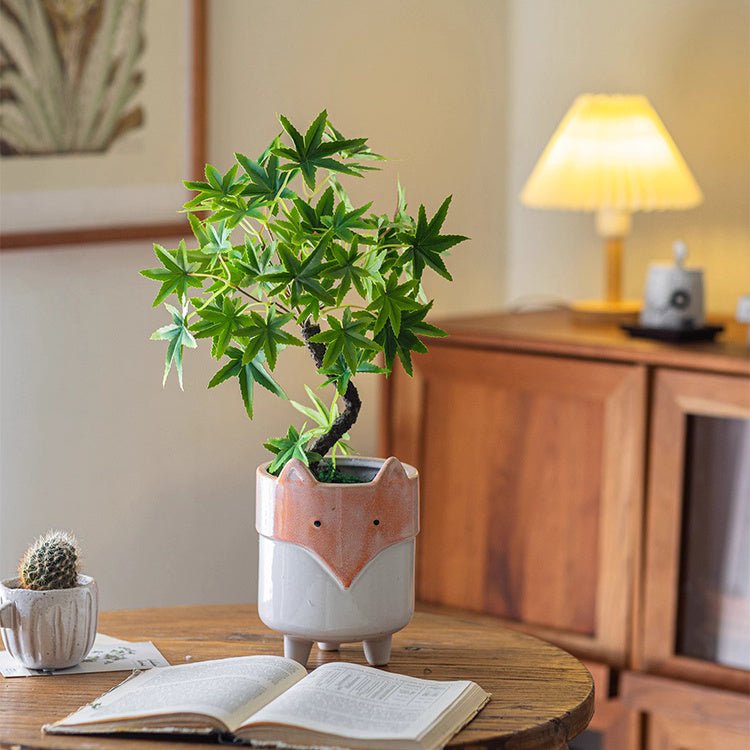 Mini faux potted green plant in peach and white ceramic pot by RusticReach on table on Tampa Home & Garden Store
