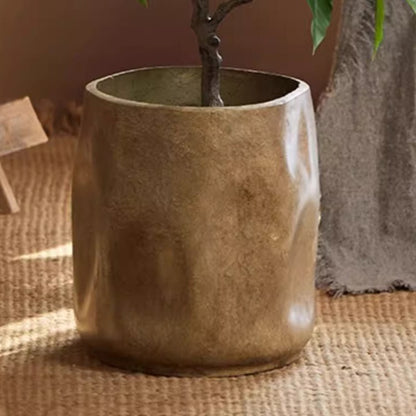 Modern Magnesium Planter by RusticReach, bronze-gold cylindrical pot on a jute rug on Tampa Home & Garden Store