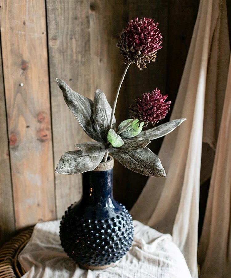 Artificial tall stem Mulan thistle burgundy blooms with gray-green leaves in navy hobnail vase on Tampa Home & Garden Store