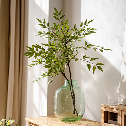 Green Nandina Leaf Stem RusticReach artificial flora in a light green glass vase on wood table on Tampa Home & Garden Store