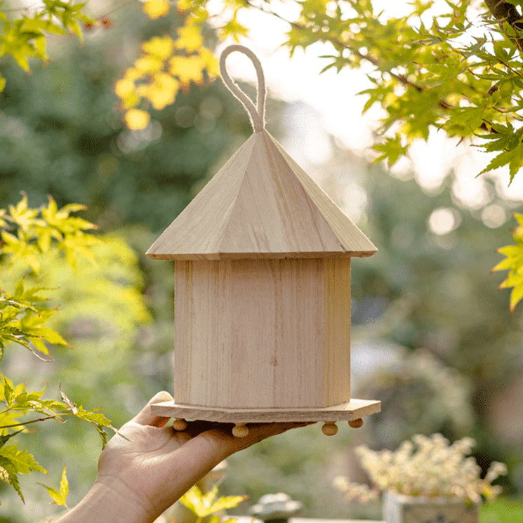 Natural solid wood bird house with cone roof, hanging loop, garden-ready rustic design on Tampa Home & Garden Store