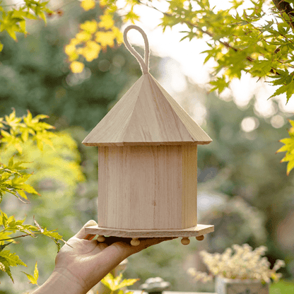 Natural solid wood bird house with cone roof, hanging loop, garden-ready rustic design on Tampa Home & Garden Store
