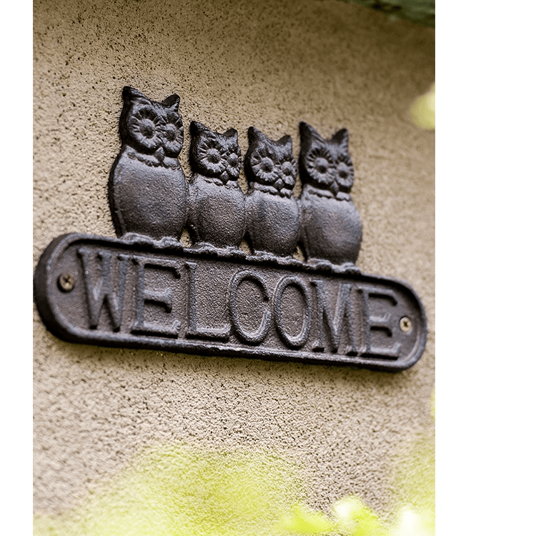 Four Owls Cast Iron Welcome Sign with four owl figures RusticReach on Tampa Home & Garden Store