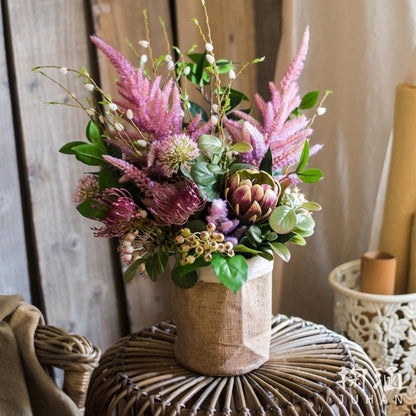 Paper Bag Style Concrete Garden Pot by RusticReach with pink dried bouquet on a woven rattan table on Tampa Home & Garden Store