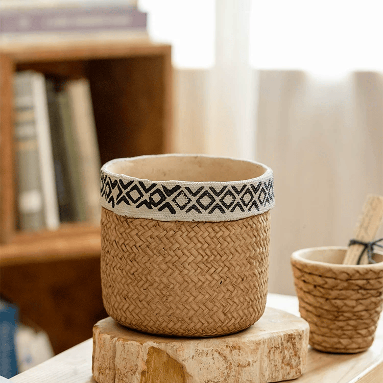 Patterned rattan cement planter with white rim; two planters on a wood surface on Tampa Home & Garden Store