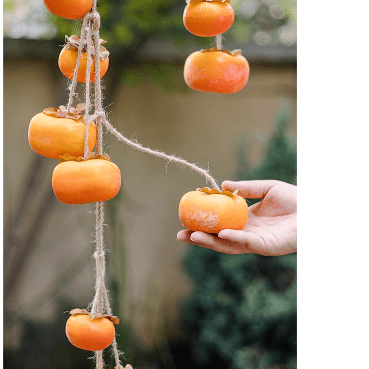Artificial persimmon fruit string decor with several orange fruits on rustic twine 33.8in long on Tampa Home & Garden Store