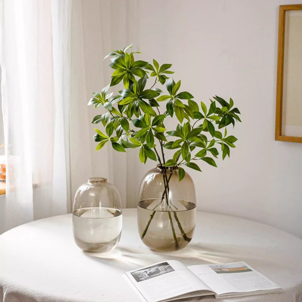 Faux Pieris Branch Stem by RusticReach artificial green leaves in a clear glass vase on Tampa Home & Garden Store