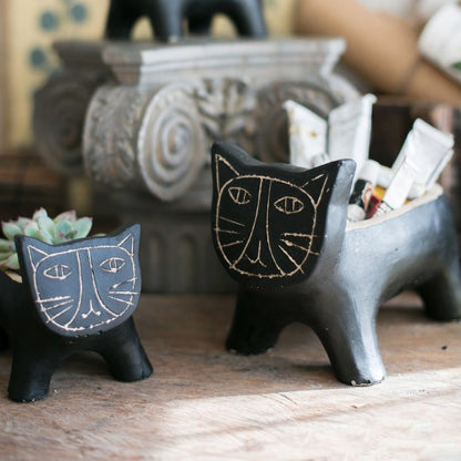 Cat Shape Small Planter in Concrete, two black cat-shaped planters with chalk-face details on Tampa Home & Garden Store