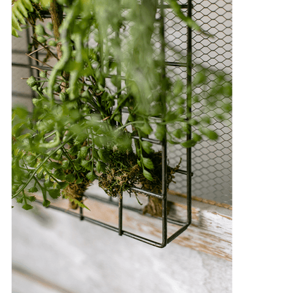 Artificial faux plant in a metal frame wall decor with green leafy mesh grid on Tampa Home & Garden Store