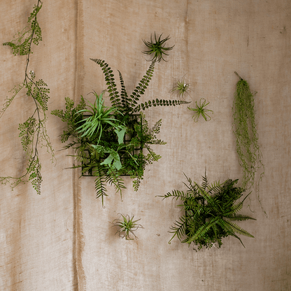 Artificial faux plant metal frame wall decor with green ferns in black frames on beige backdrop on Tampa Home & Garden Store