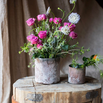 Rust Style Art Glass Vase by RusticReach with weathered metal finish holding pink roses on Tampa Home & Garden Store