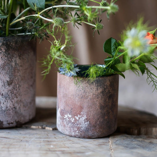 Rust Style Art Glass Vase by RusticReach; two rusted metal vases with patina and greenery on Tampa Home & Garden Store