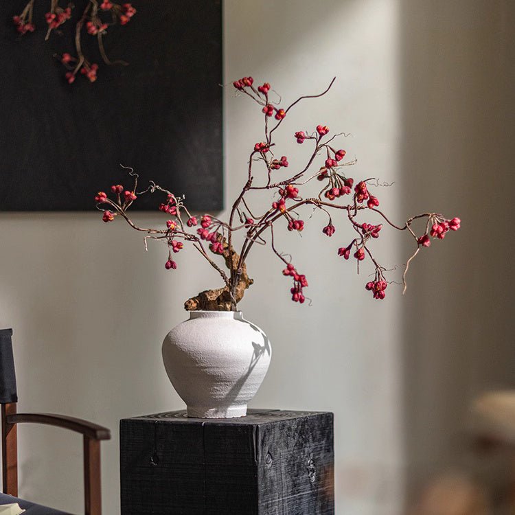 Artificial Red Budded Twig 41.7 inches tall in a white ceramic vase on a dark wood pedestal RusticReach on Tampa Home & Garden Store