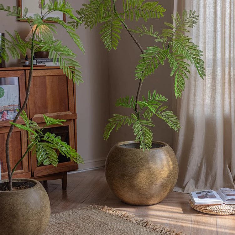 Round Magnesium Clay Planters by RusticReach, bronze-gold finish (2) with lush fern plants on Tampa Home & Garden Store