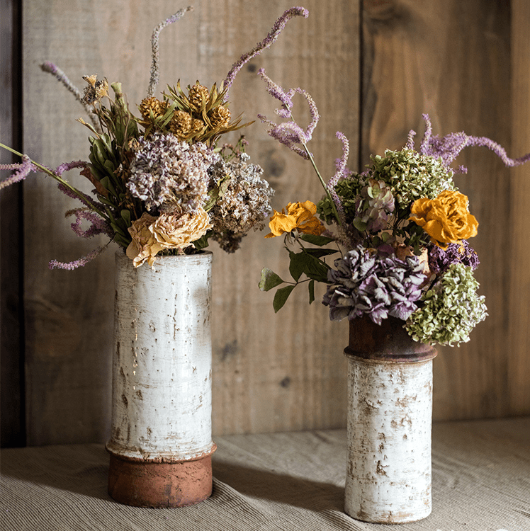 Restoration Ceramic Planter Vases two white with rustic bases and dried florals on Tampa Home & Garden Store