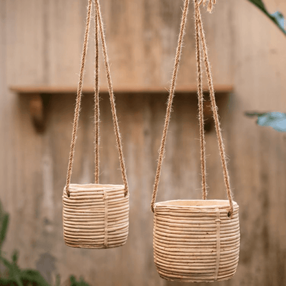 Faux rattan cement hanging planters by RusticReach, two beige woven pots with jute hangers on Tampa Home & Garden Store