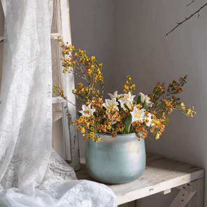 Ruhai Low Glass Vase pale teal rounded low design with white lilies and orange blossoms on Tampa Home & Garden Store